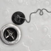 smell shower drain. image of a shower drain and plug.